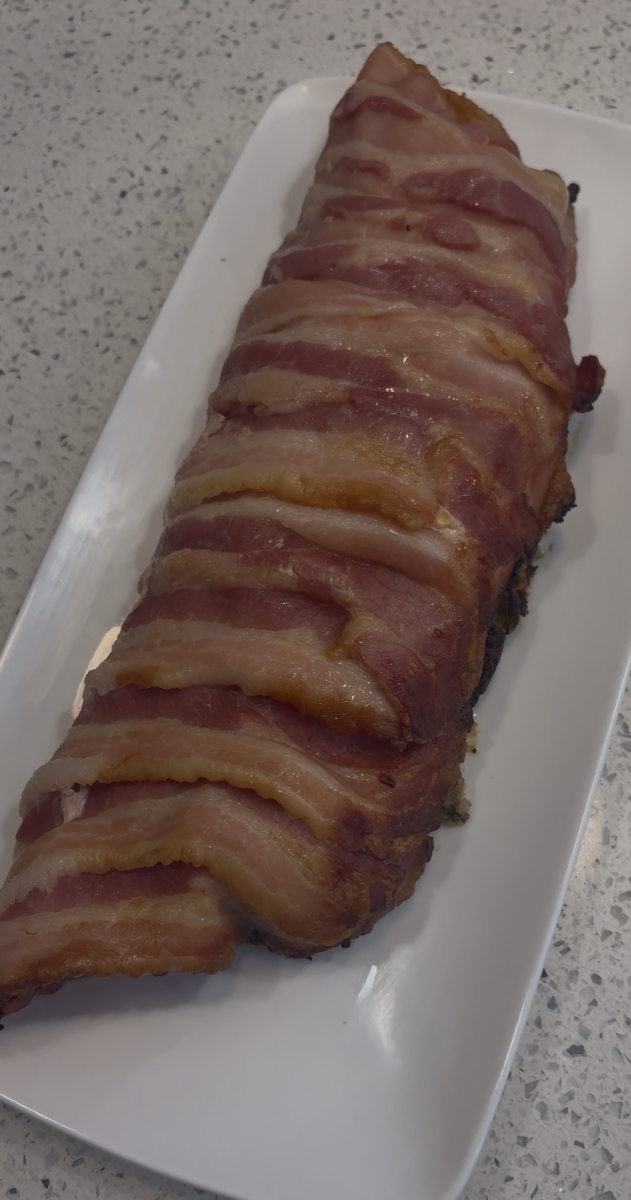 Stuffed pork tenderloin wrapped in bacon
