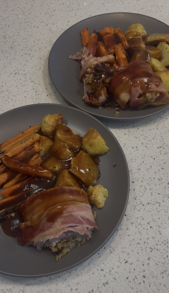 Served stuffed pork tenderloin wrapped in bacon