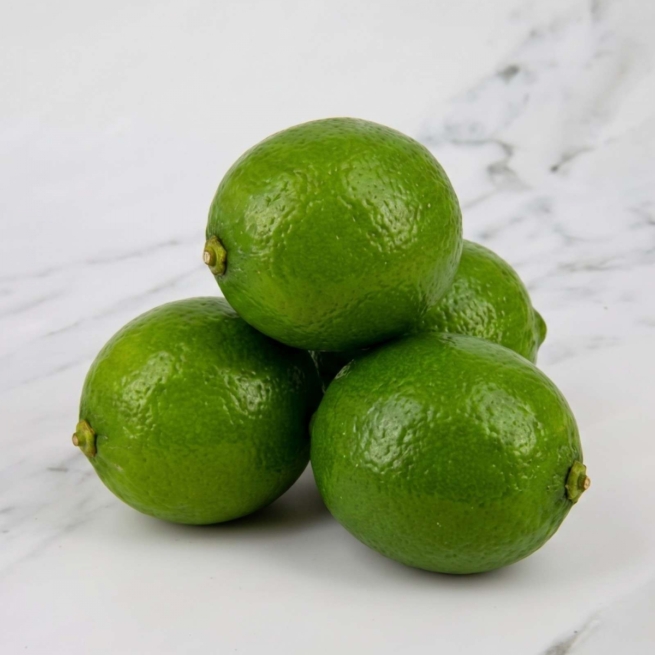 A premium pack of four fresh, vibrant green limes hand-selected for quality at the Eric Lyons farm shop.